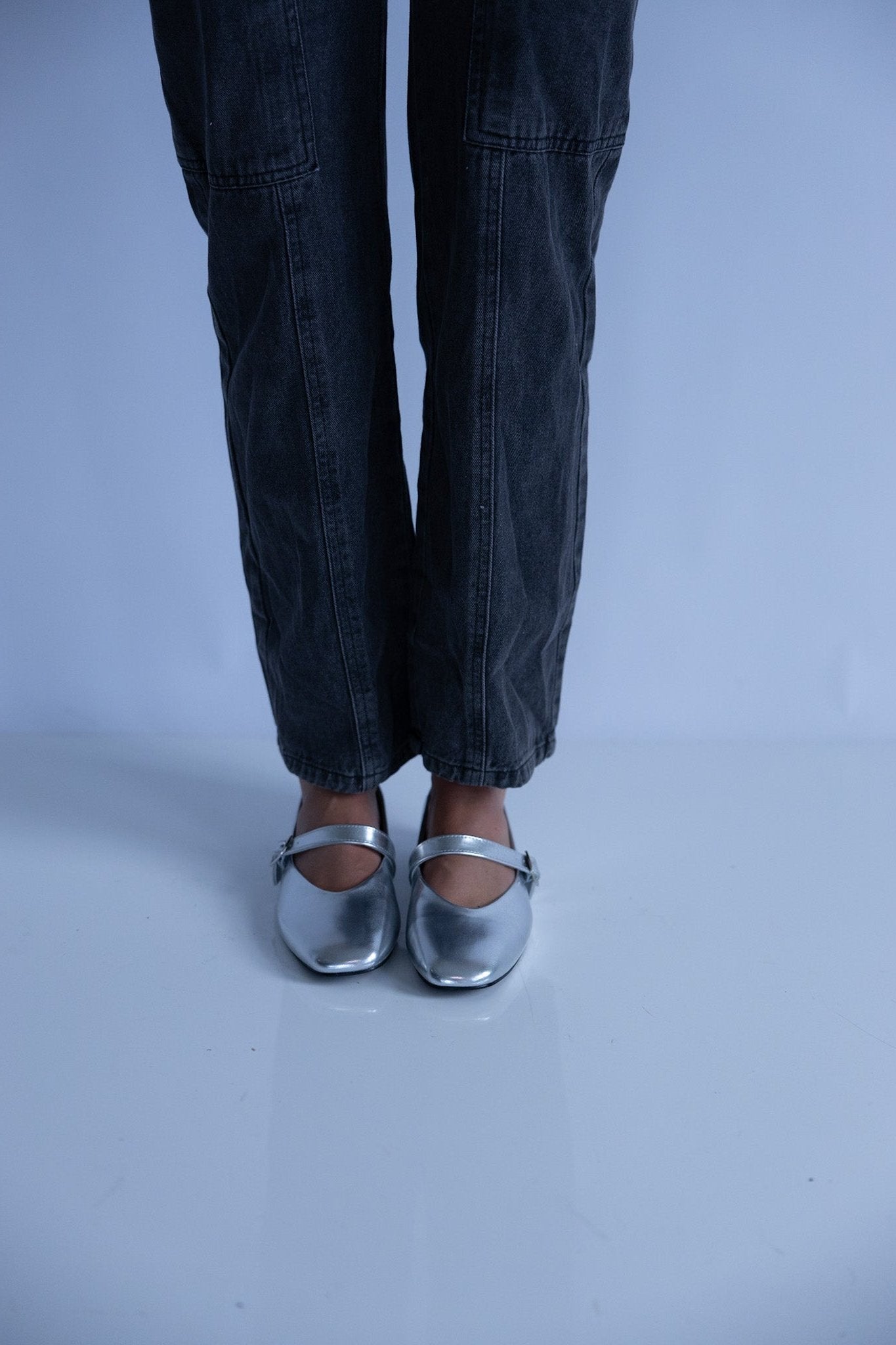 women wearing silver ballet flats